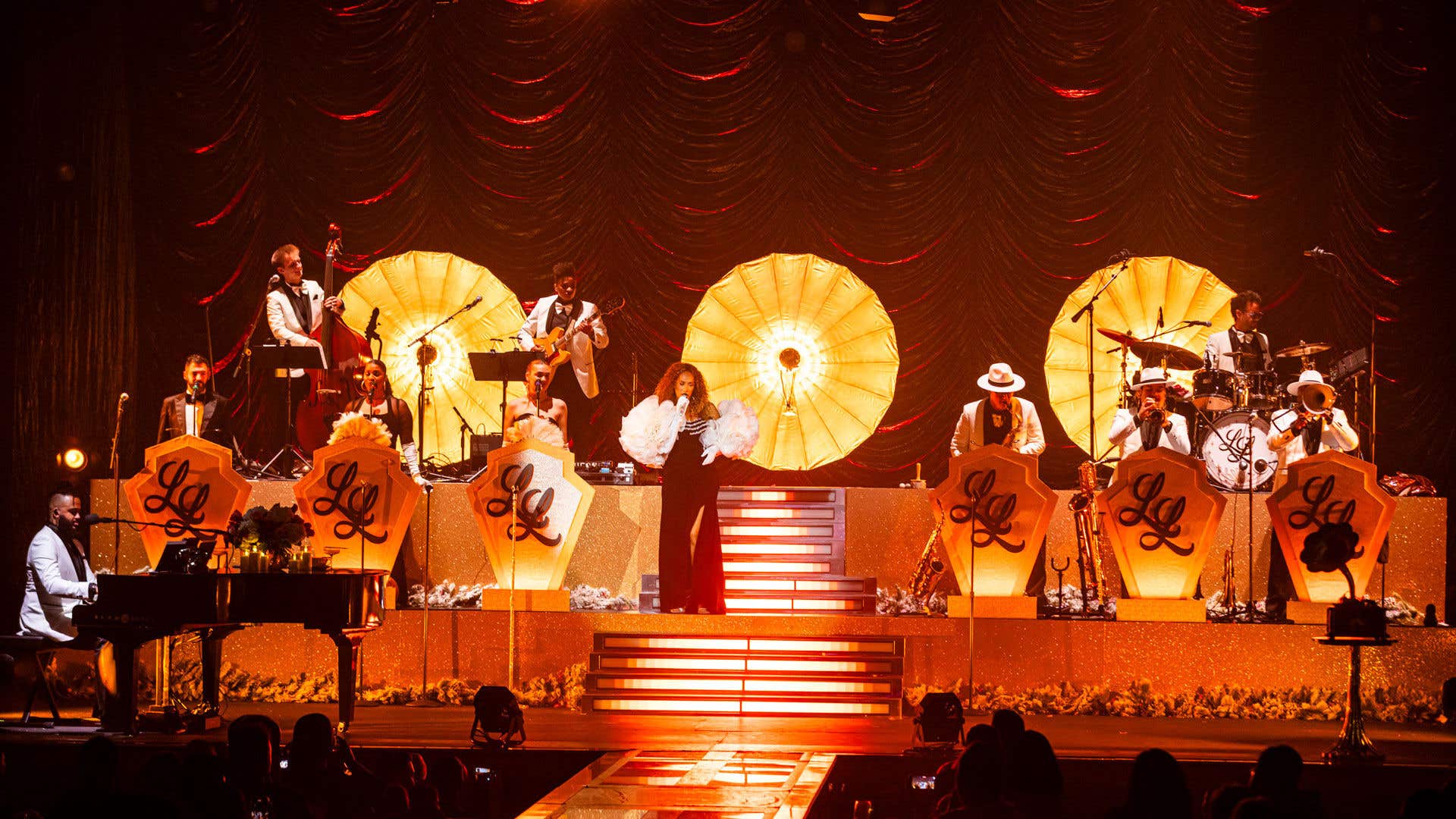 Leona Lewis performing center stage during her concert at Voltaire, backed by a full band.